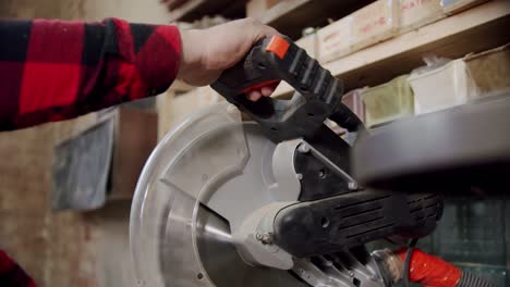 Slow motion the master cuts a wooden board with a circular saw in the woodworking workshop of a small furniture manufacturer. Vercion 3