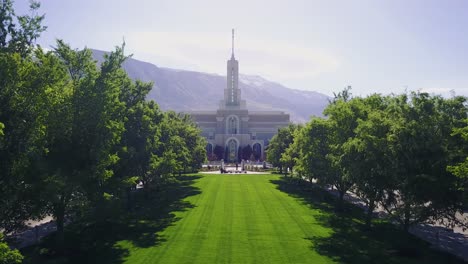 drone shot flying towards the mount timpanogos temple