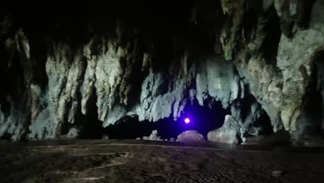 shot of stalactites and stalagmites at tabuhan cave in pacitan, east java, indonesia