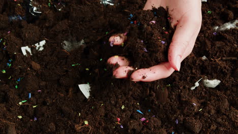 plastic and other waste in the soil