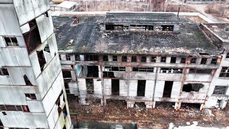 deserted and solitary industrial zone of a plant destroyed with time. abandoned territory dangerous for visiting. view from above.