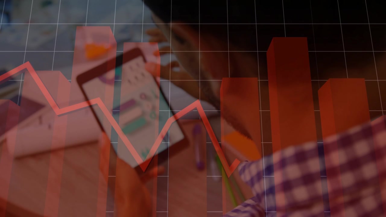 Man tapping tablet and swiping screen, syncing red bar and line charts across desk for finance