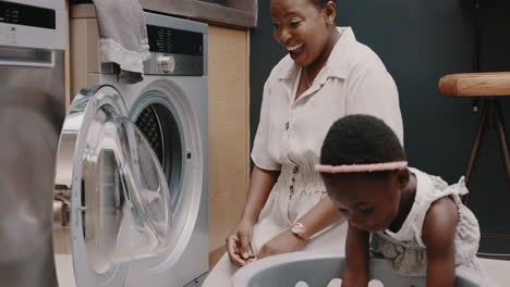 mother, child and laundry with high five