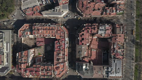 Overhead-view-of-development-in-urban-borough.-Blocks-of-buildings-and-streets-in-city.-Barcelona,-Spain