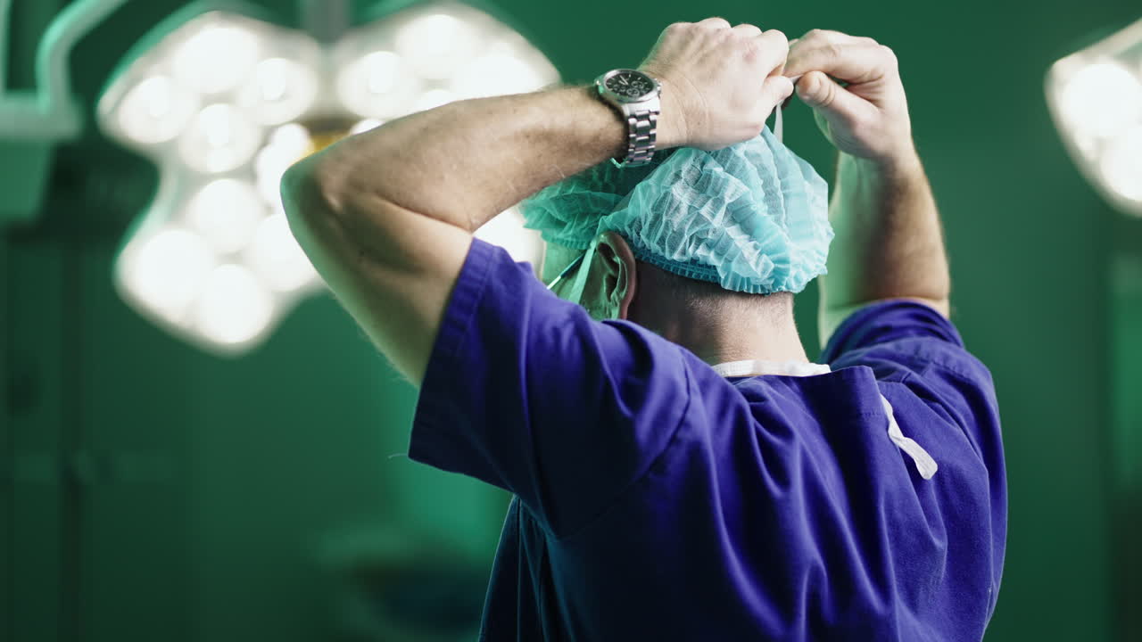 Surgeon preparing for surgery in operating room