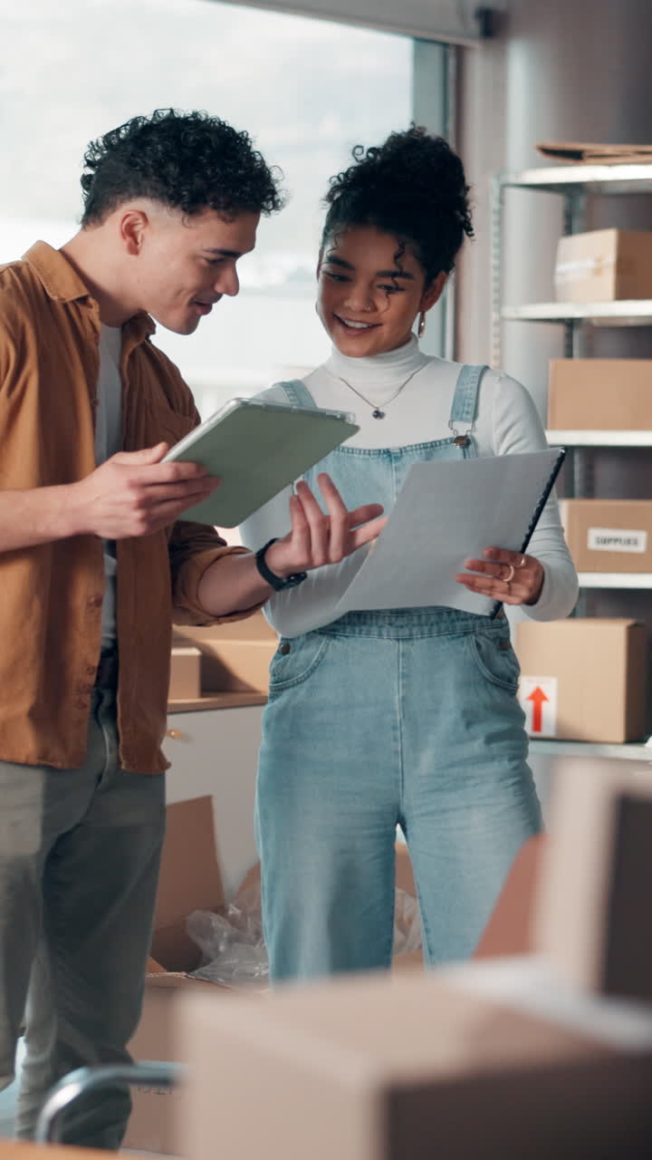 Young Business Owners Collaborating and Celebrating Success in Their Office
