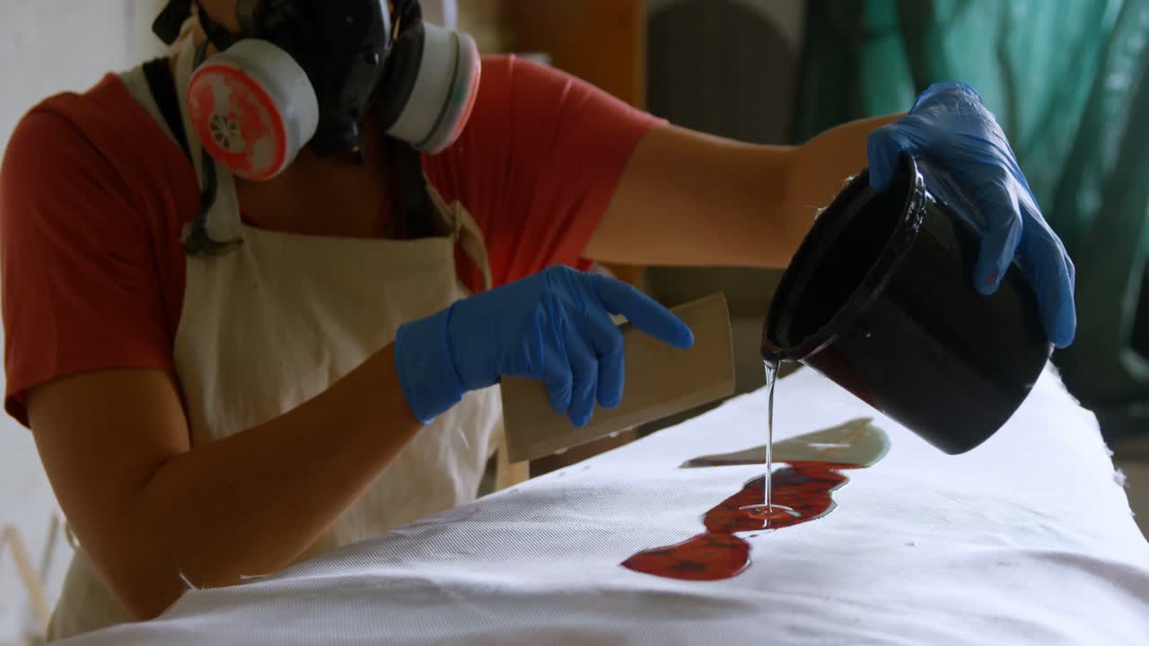 Woman making surfboard 4k