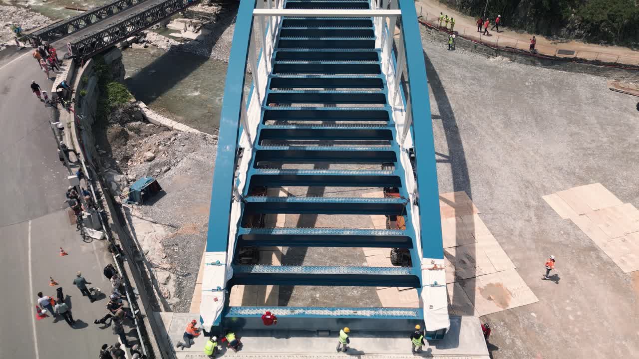 Bridge Construction and Repair: Aerial View of Workers on a New Metal Bridge