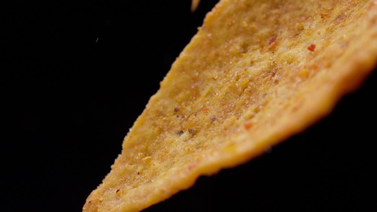 Tempting crunchy delicious nachos, crispy flavoursome snacks, close-up