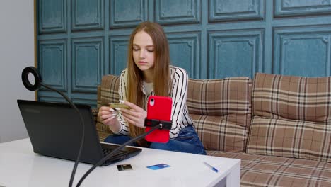 Woman-ordering-food,-making-shopping-payments-purchases-from-bank-credit-card-on-laptop-computer