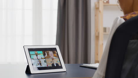 woman in a video call on tablet computer