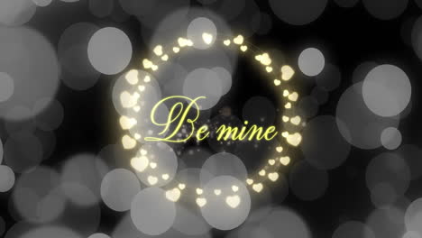 animation of be mine text over hearts and spots