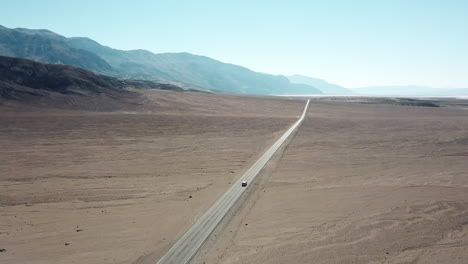 car driving on highway in death valley national park in california, usa