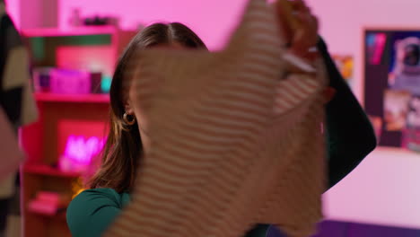 woman in a room with pink lighting