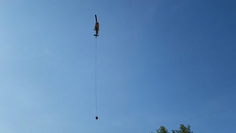 water bombing helicopter preparing to refill