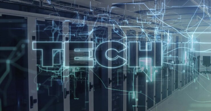 Blue filaments appearing over racks tracing circuits forming glowing TECH letters revealing network