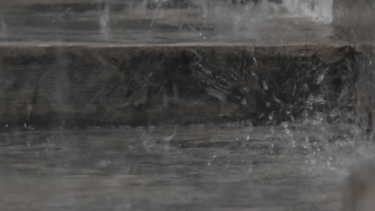 Raindrops Splashing on Wet Concrete Floor During Heavy Rainfall
