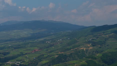 Drone-footage-of-large-electric-windmill-on-top-of-a-hill