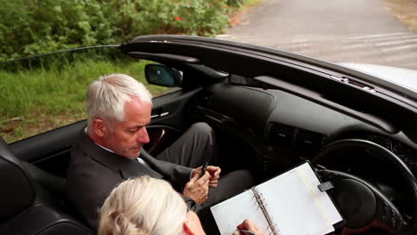 Couple-in-a-silver-car