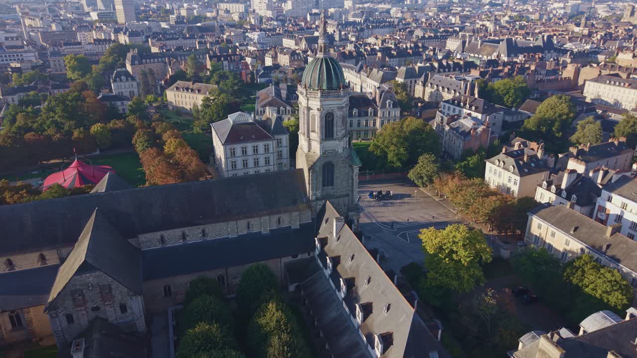 Drone orbit capturing view of the historic Notre-Dame-en-Saint-Melaine Church and its expansive courtyard in the Centre Rennes district, in the north eastern part of the medieval city center