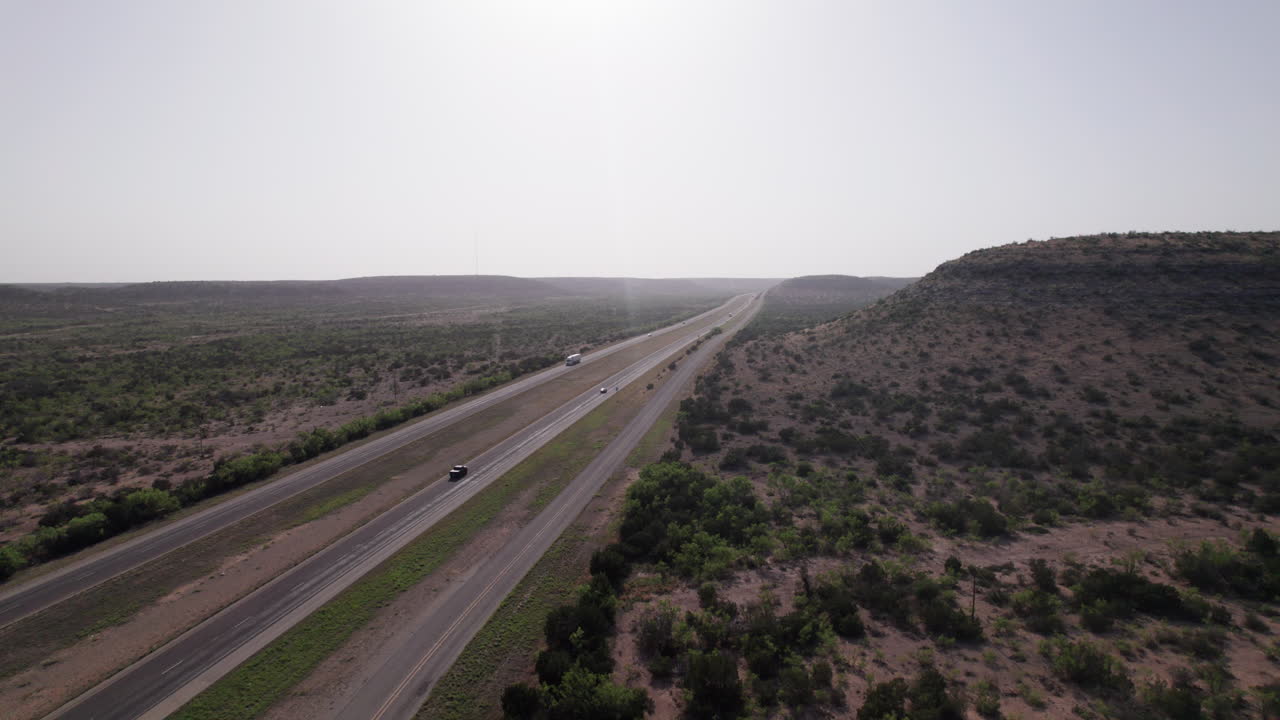 18 wheelers drive along I-10 Highway in the west Texas desert
