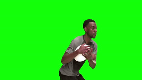 serious rugby player catching ball