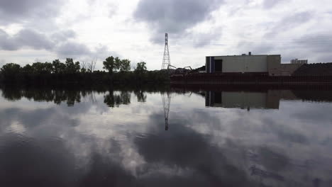 Aerial-Footage-of-metal-recycling-plant-on-the-Mississippi-River