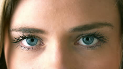 Pretty-blonde-opening-her-eyes-close-up