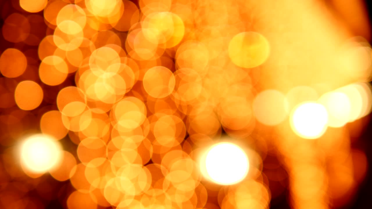 Blurred background with Golden lights with Bokeh Night city life.