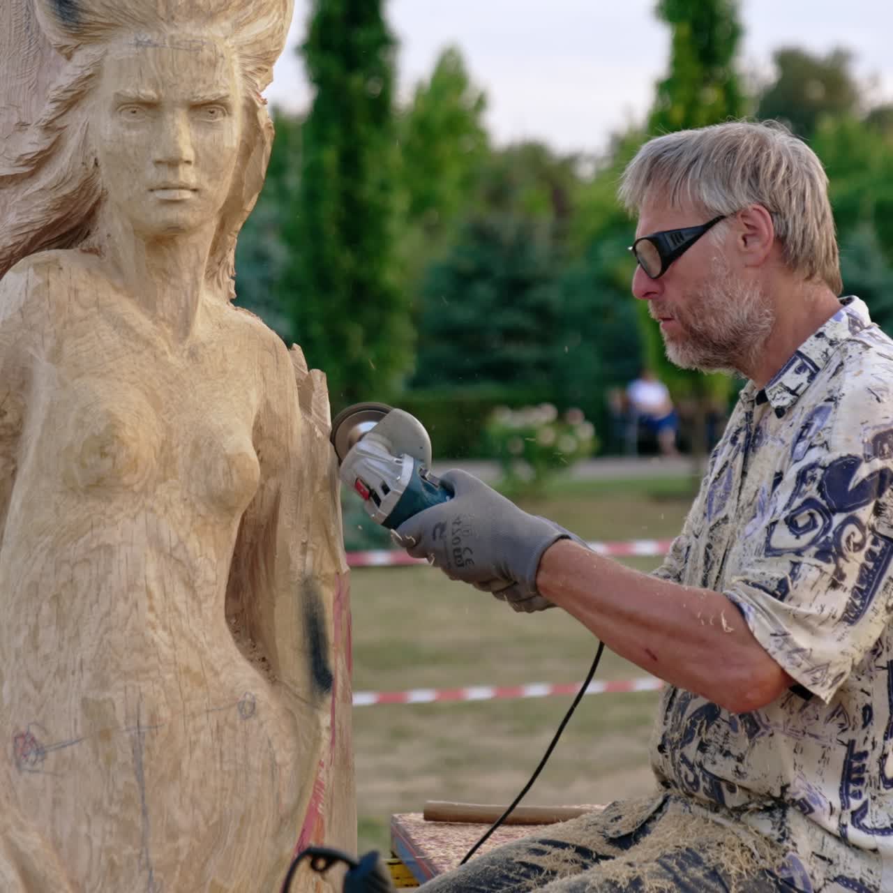 Craftsman professional worker. Artist making wooden sculpture
