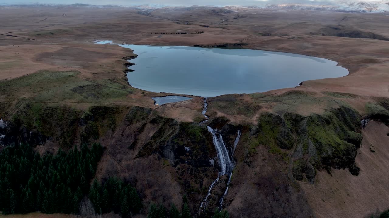 Scenic Landscape Of Systrafoss Waterfall And Lake Systravatn, Kirkjub&aelig;jarklaustur, Iceland - Drone Shot