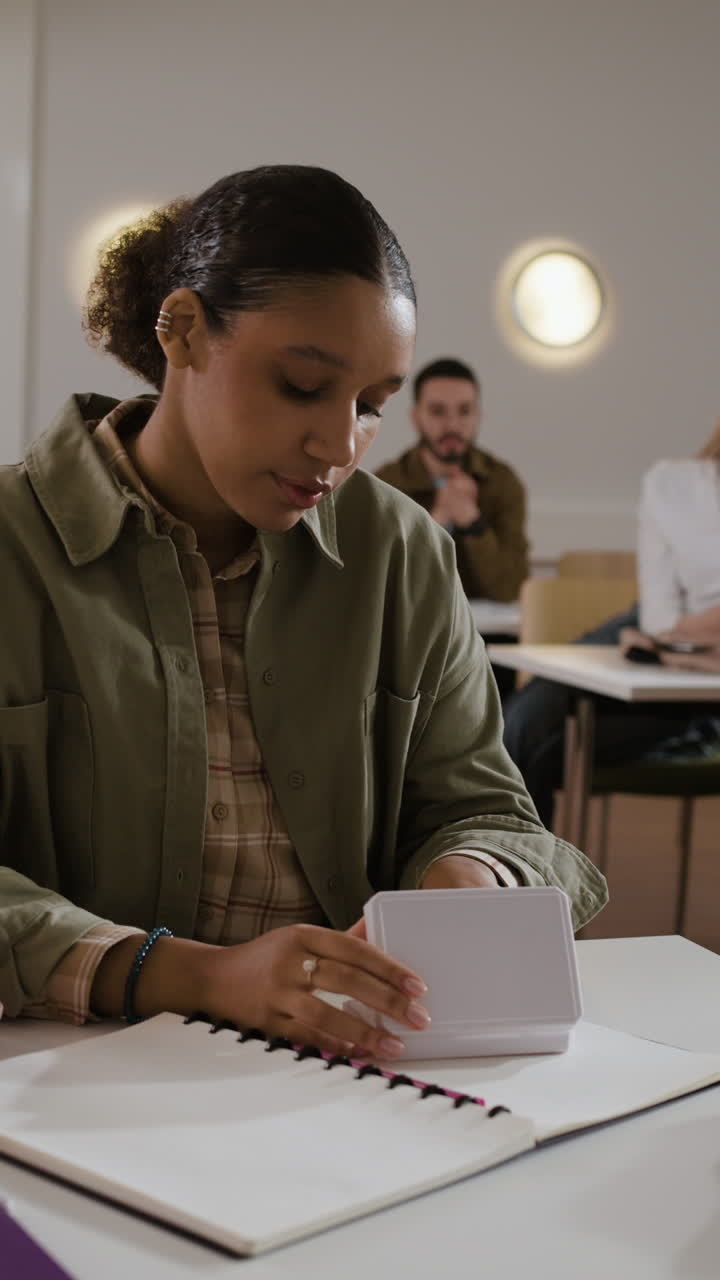 A woman studying in a classroom