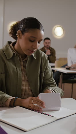 a woman studying in a classroom
