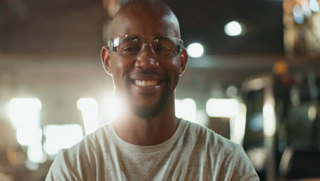man in safety glasses smiling