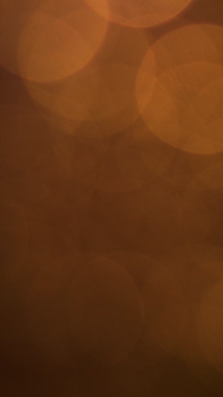 Abstract Luci bokeh arancione su sfondo scuro