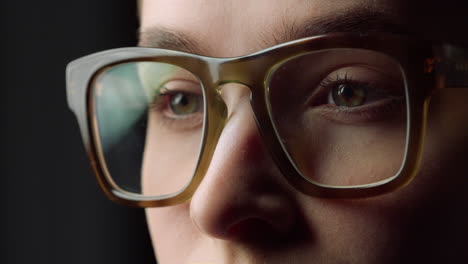 Portrait-tired-student-girl-closing-eyes-glasses-in-black-studio.Businesswoman