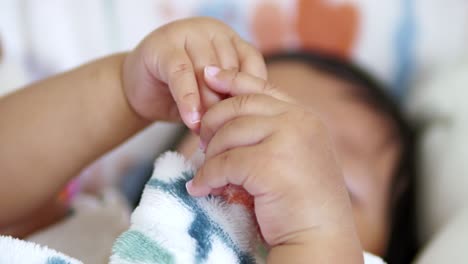 a close-up of a newborn's hands showcasing the beauty of tenderness and connection.