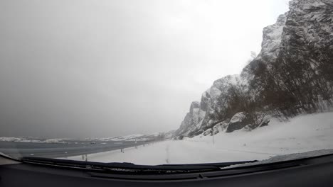 road covered in snow in norway, view from the car