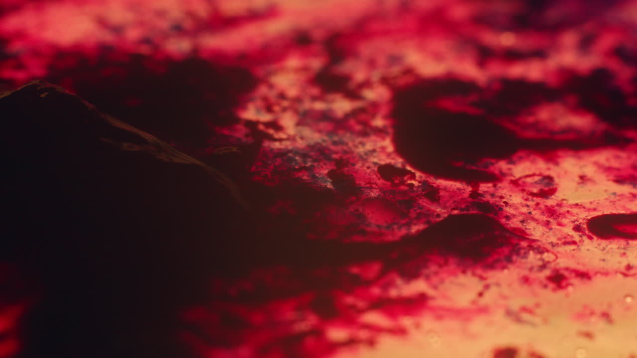 Colourful, organic, liquids macro shots buzzing and flowing