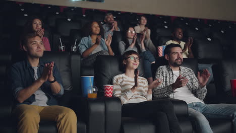 moviegoers applauding in a cinema
