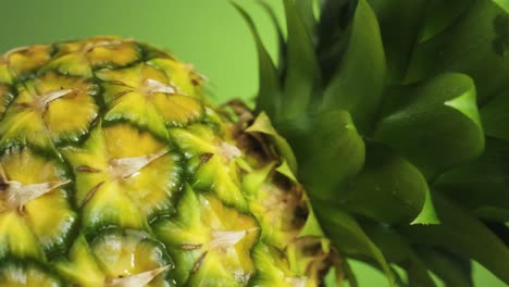 Water-drops-splashing-on-Pineapple-peel,-Close-up-Shot---Slow-motion