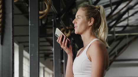 Side-view-athletic-Caucasian-woman-talking-on-the-phone