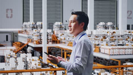 warehouse worker using a smartphone