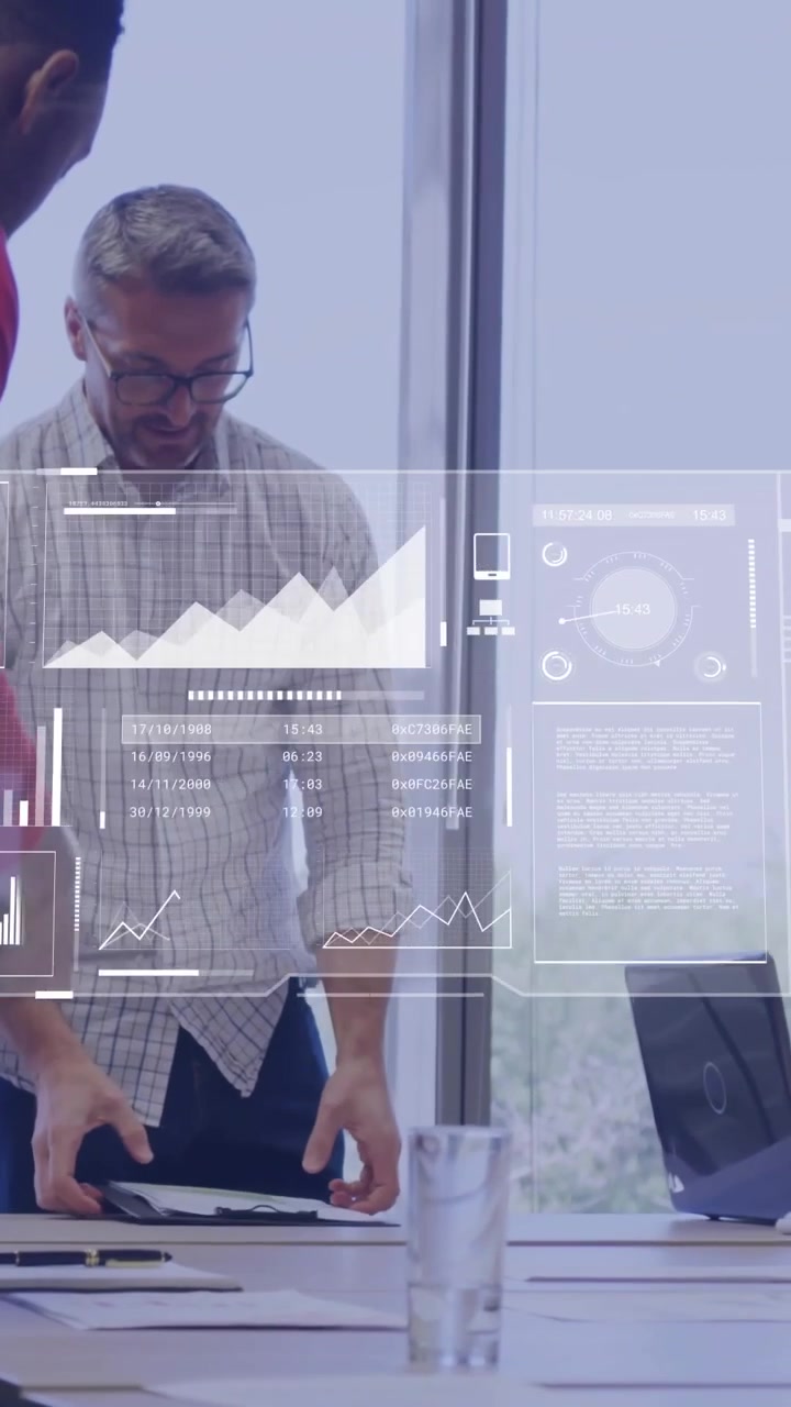 Vertical video: Lead leaning over table after team handing papers, reviewing business data overlays
