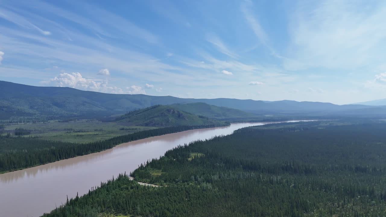 Majestic river winds through Alaska's pristine wilderness, a breathtaking aerial perspective revealing nature's untouched beauty for travel inspiration