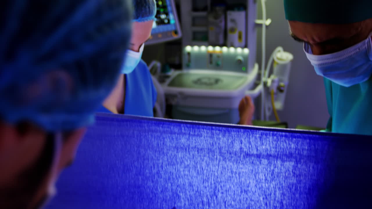 Doctor examining pregnant woman during delivery