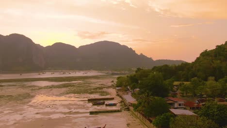 sunset over a thai island beach town