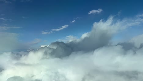 Aerial-view-from-a-cockpit-flying-trough-white-and-grey-clouds