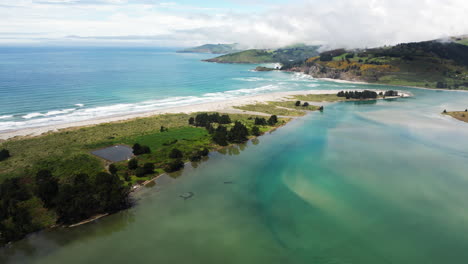 magical bay and mountains of new zealand, aerial drone view