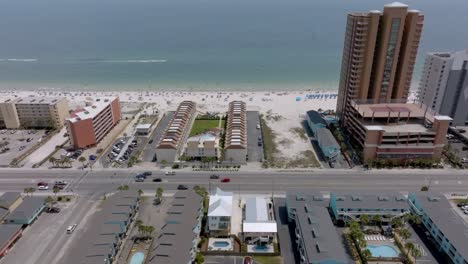 Gulf-Shores,-Alabama-skyline-and-beach-with-drone-video-moving-right-to-left